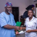 Ikeja Council Chair Gifts Free GCE Forms to Students