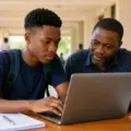 Nigerian student completing FUNAAB Post-UTME and Direct Entry admission screening application on a laptop