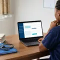 Nursing admission candidate checking an online admission result and acceptance fee deadline on a laptop