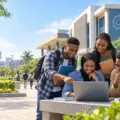 Nigerian university applicants checking an admission screening portal outside a technology-focused campus