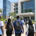 Nigerian university applicants walking towards a modern medical sciences campus building