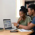 Nigerian university applicants checking an online Post-UTME screening result on a laptop