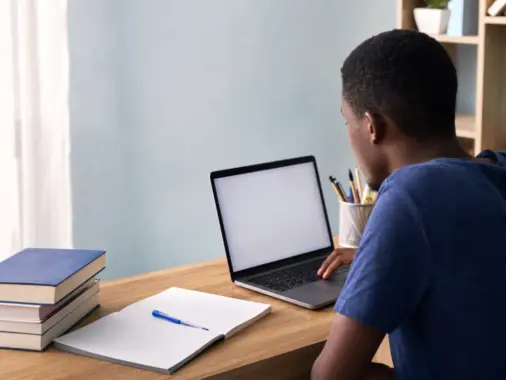 Nigerian university applicant checking a Post-UTME screening result on a laptop