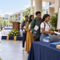Illustration of Nigerian university freshmen completing registration before a rescheduled matriculation ceremony