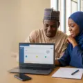 Nigerian university applicants completing an online admission screening registration on a laptop